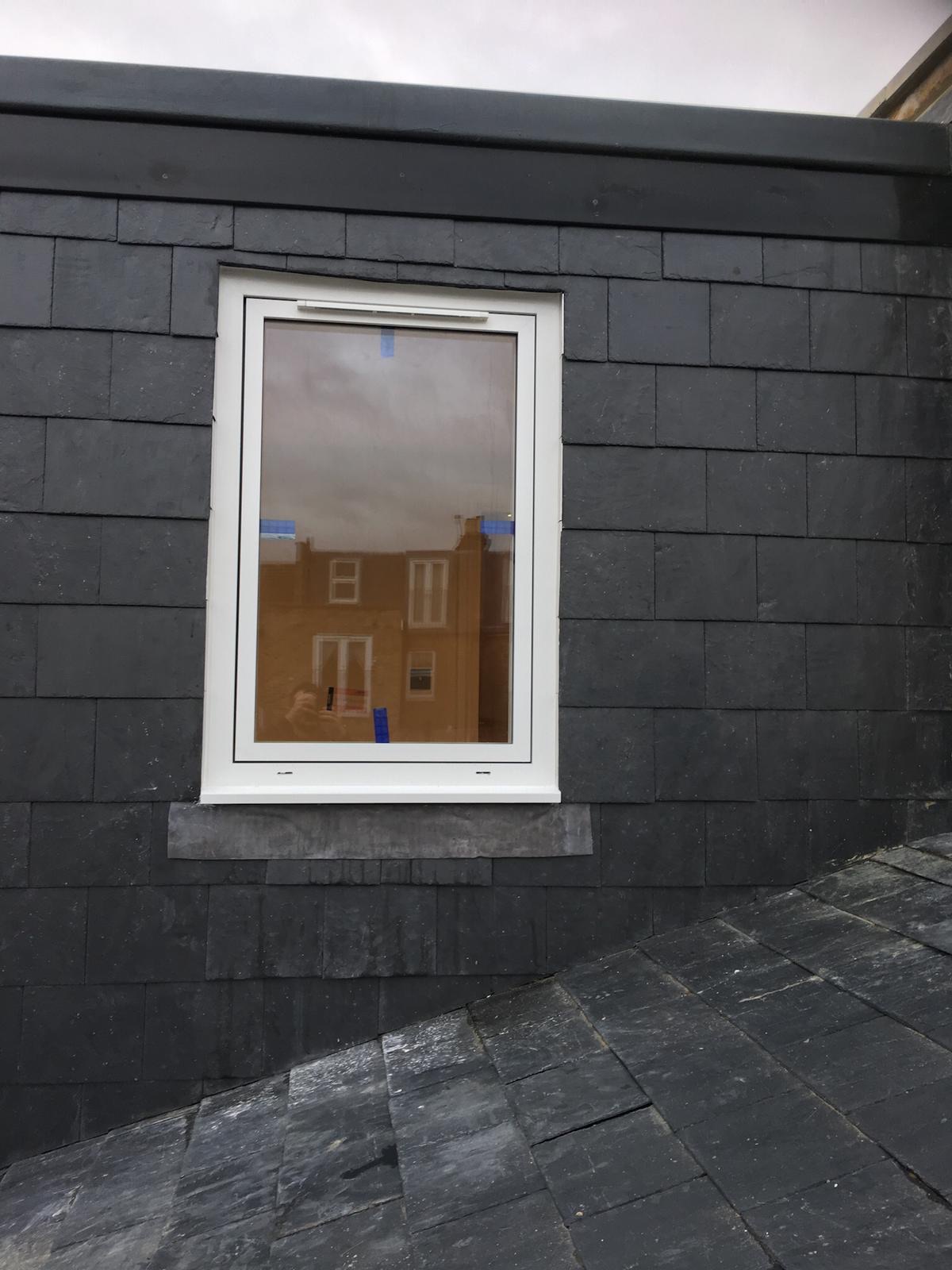 Velux window in natural slate roof